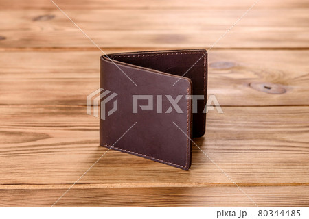 Beautiful leather brown purse made of leather to store paper money 80344485