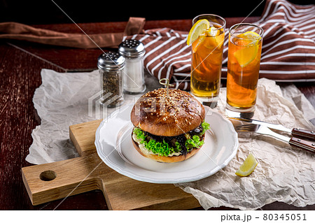 Sandwich with chicken burger, tomatoes, cheese and lettuce 80345051