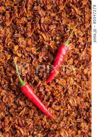 Spices from finely chopped sun-dried tomatoes. Aromatic seasoning for cooking. 80347278