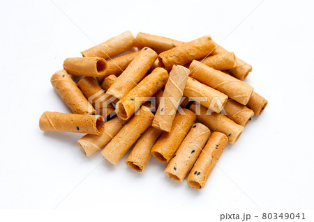 Thai crispy coconut rolls on white Thai crispy coconut rolls on white 80349041