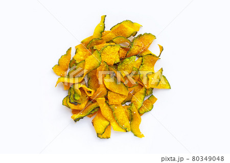 Green pumpkin slice chips on white background. Green pumpkin slice chips on white background. 80349048