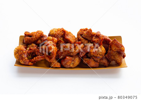 Chispy fried chicken skin on white background. Chispy fried chicken skin on white background. 80349075