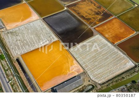 Phetchaburi Salt flats Naklua, farms and farmers collecting salt in Phetchaburi, Thailand 80350187