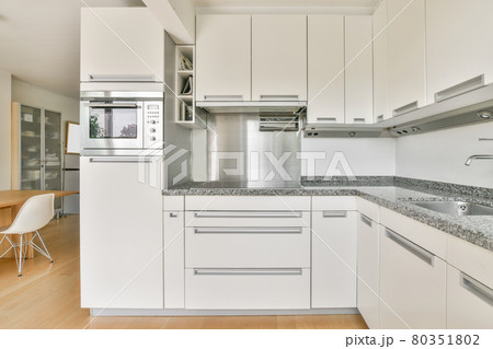 Interior of a beautiful kitchen of an elite house Interior of a beautiful kitchen of an elite house 80351802