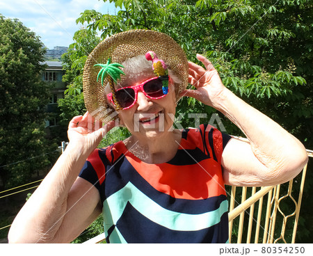 Funny senior woman against summer background 80354250