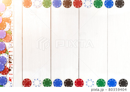 Playing cards and poker chips on white wooden background. Top view Playing cards and poker chips on white wooden background. Top view 80359404