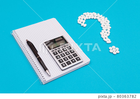 White Question Mark and Calculator. Pharmaceutical Industry and Medicinal Products White Question Mark and Calculator. Pharmaceutical Industry and Medicinal Products 80363782
