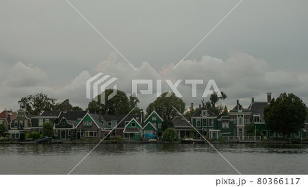 Timelapse of clouds over houses on river bank, Netherlands Timelapse of clouds over houses on river bank, Netherlands 80366117