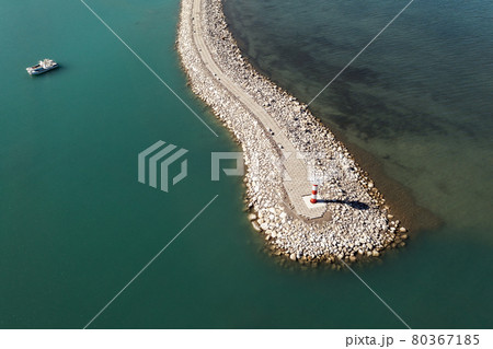 Road and lighthouses on the lake. Shot in Sayram Lake in Xinjiang, China. 80367185