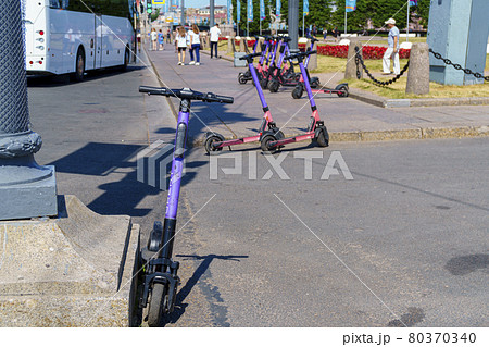Rental station of electric scooters in downtown of St. Petersburg in summer 80370340