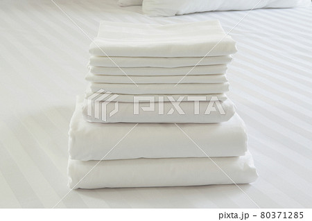 White pillowcase on white bed White pillowcase on white bed 80371285
