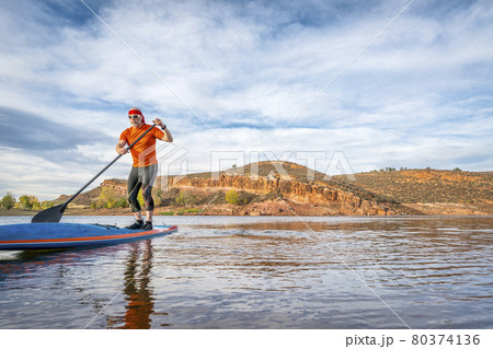 stand up paddling on mountain ake stand up paddling on mountain ake 80374136