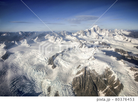 Mountains covered by snow and ice, aerial shot made from plane above Mount Cook and Franz Josef Glacier in West Coast Region of New Zealand Mountains covered by snow and ice, aerial shot made from plane above Mount Cook and Franz Josef Glacier in West Coast Region of New Zealand 80376453