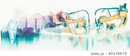 Mechanized industry robot arm and factory worker double exposure 80376679