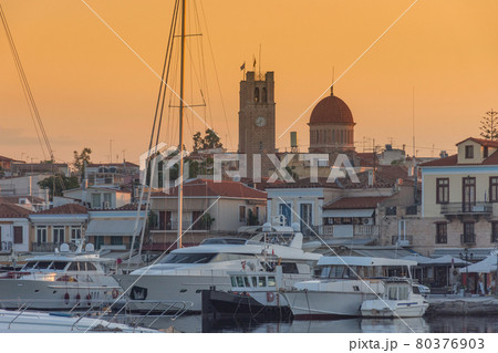 Port of Aegina town with yachts and fishermen boats docked in Aegina island, Saronic gulf, Greece, at sunrise. Port of Aegina town with yachts and fishermen boats docked in Aegina island, Saronic gulf, Greece, at sunrise. 80376903