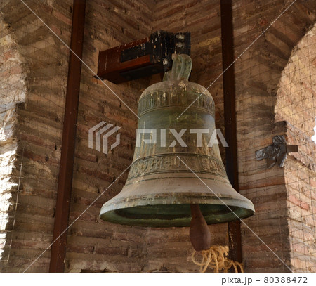 Ancient bronze bell in the tower of an old building 80388472