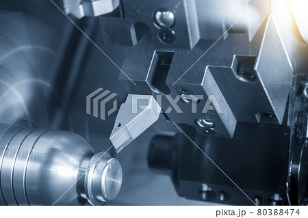 The  CNC lathe machine cutting the metal shaft parts. 80388474