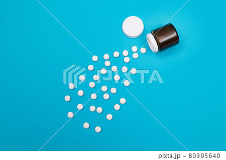 Pharmaceutical Industry and Medicinal Products - White Pills on Blue Background Pharmaceutical Industry and Medicinal Products - White Pills on Blue Background 80395640