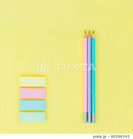 lead pencil and sticky notes on yellow paper background 80396545