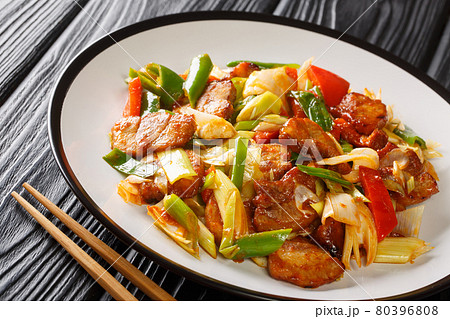 Chinese Spicy Pork Stir Fry Twice Cooked Pork cooked in sauce and vegetables closeup in the plate. Horizontal 80396808