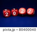Dice with new year 2022 on blue background 80400040