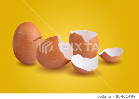 Empty broken chicken eggshell on yellow background Empty broken chicken eggshell on yellow background 80401498