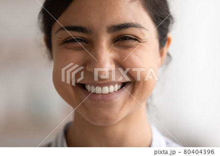 Head shot close up of beautiful happy Indian woman Head shot close up of beautiful happy Indian woman 80404396