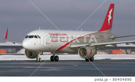 Airplane A320 of Air Arabia taxiing at Sheremetyevo Airport, winter view. Moscow 80404890
