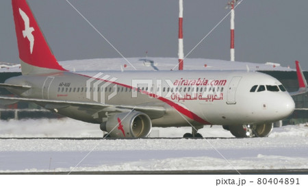 Air Arabia aircraft taxiing at Sheremetyevo Airport in Moscow. Winter view Air Arabia aircraft taxiing at Sheremetyevo Airport in Moscow. Winter view 80404891