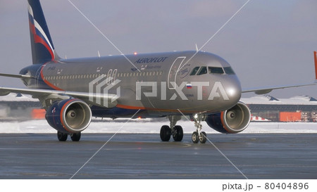 Winter view of taxiing aircraft A320 of Aeroflot at Sheremetyevo Airport, Moscow 80404896