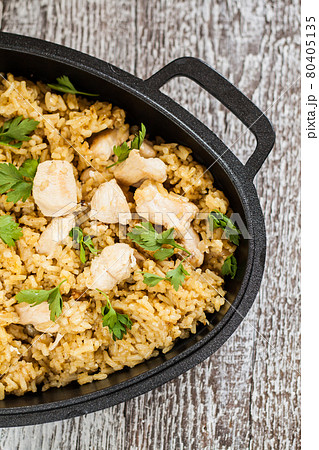 Pilaf rice-curry with chicken and salad in the form of iron 80405135