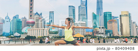 Fitness woman doing yoga in Shanghai city banner Fitness woman doing yoga in Shanghai city banner 80409408