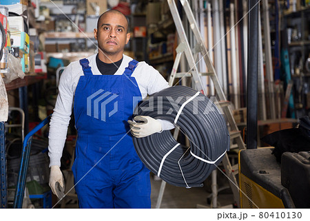 Latin american handyman man choosing building materials in store 80410130
