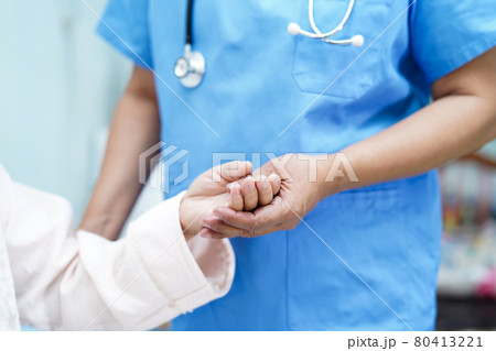 Holding Touching hands Asian senior or elderly old lady woman patient with love, care, helping, encourage and empathy at nursing hospital ward : healthy strong medical concept . 80413221