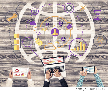 Top view of businesspeople sitting at table and using gadgets 80416245