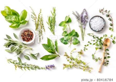 Fresh aromatic herbs, overhead flat lay shot on a white background with spices Fresh aromatic herbs, overhead flat lay shot on a white background with spices 80416784