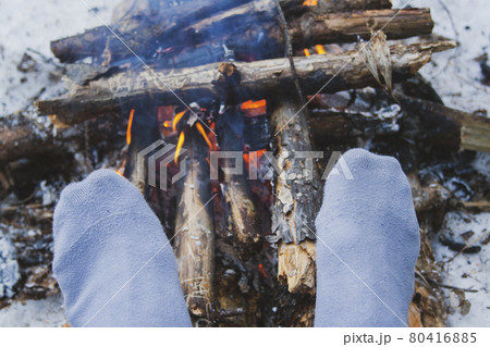 Man's legs against the bonfire 80416885