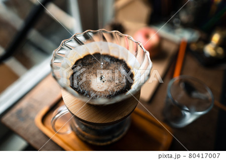 drip coffee in house,Pouring a hot water over a drip coffee 80417007