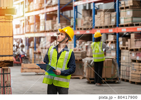 Warehouse worker working together in warehouse Warehouse worker working together in warehouse 80417900