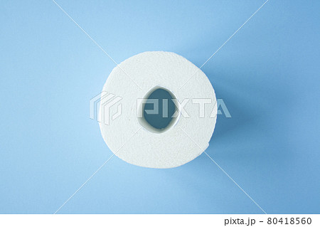 Toilet paper roll on a blue background top view. 80418560