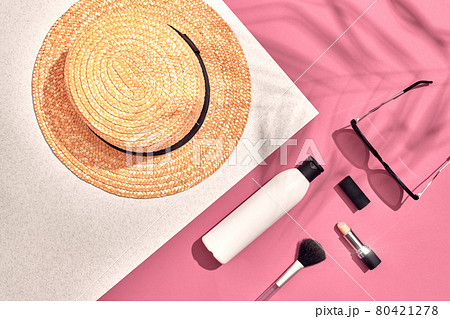 Woman's accessories lying flat on textured paper background. Pink and white pastel colors with copy space around products. Woman's accessories lying flat on textured paper background. Pink and white pastel colors with copy space around products. 80421278