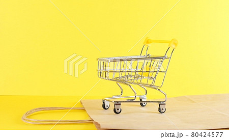 empty Shopping cart on a yellow background, closeup. Black Friday Shopping and Discount Concept 80424577