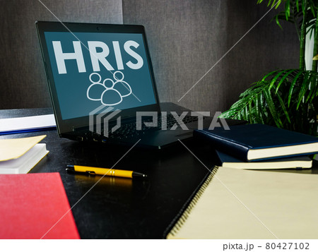 Open laptop with HRIS Human resource management system. 80427102