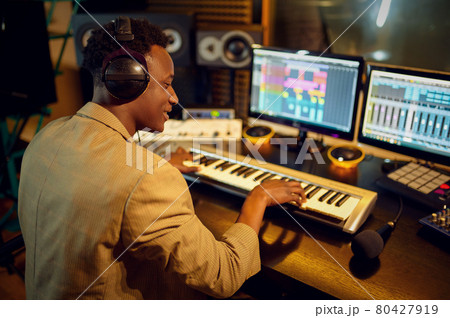 Male dj listening a record, recording studio Male dj listening a record, recording studio 80427919