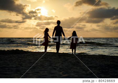 Family vacation sunset happy together at the beach  80428669