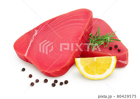 Fresh tuna fish fillet steak with rosemary, lemon and peppercorns isolated on white background with clipping path and full depth of field Fresh tuna fish fillet steak with rosemary, lemon and peppercorns isolated on white background with clipping path and full depth of field 80429575