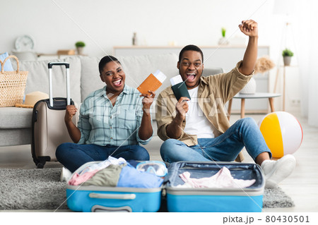 Happy Black Travelers Gesturing Yes Posing With Travel Tickets Indoors Happy Black Travelers Gesturing Yes Posing With Travel Tickets Indoors 80430501