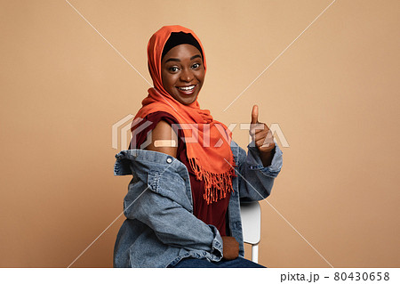 Beautiful muslim african woman in hijab got vaccinated 80430658