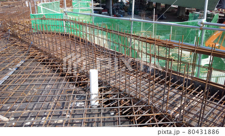 KUALA LUMPUR, MALAYSIA -NOVEMBER 23, 2020: Building floor slab under construction. Construction workers fabricating the timber formwork and installing the steel reinforcement bar.  80431886