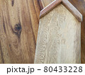 Wooden home model on wood background, copy space on wood. 80433228